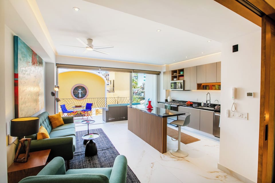 Living Room — Comfortable seating area with access to the balcony