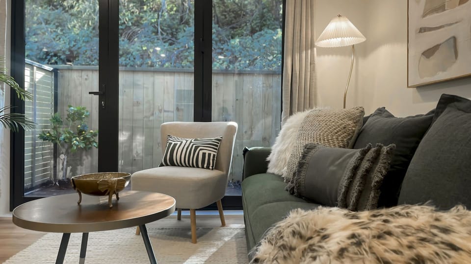 Comfortable living area with small outdoor couryard and smart TV