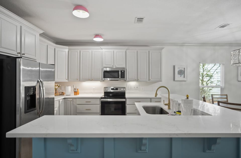 Bright, clean, and ready for anything from pancake breakfasts to seafood feasts, this kitchen is designed for effortless vacation living.