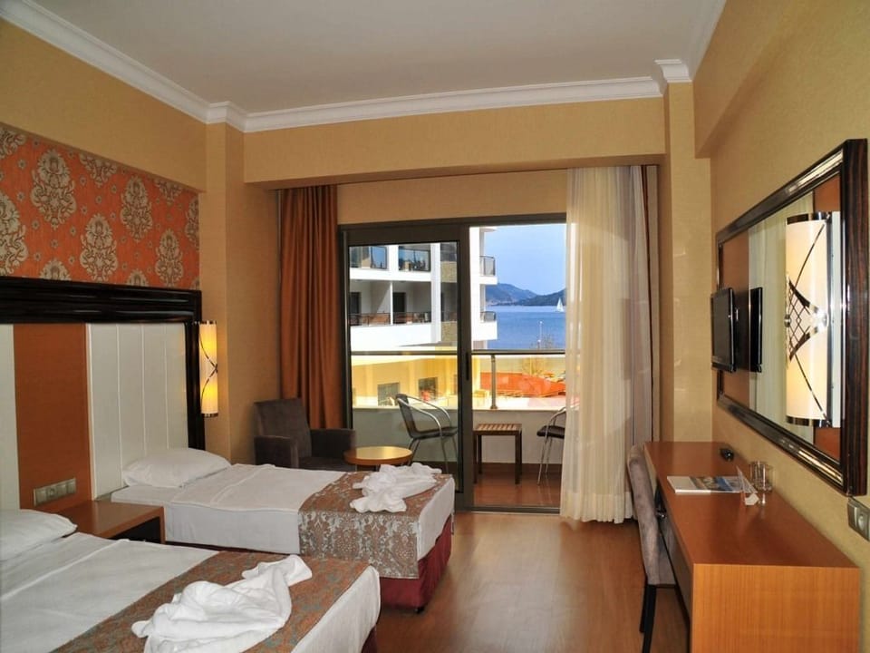Standard Double or Twin Room, Sea View | Free minibar items, free cribs/infant beds, free WiFi