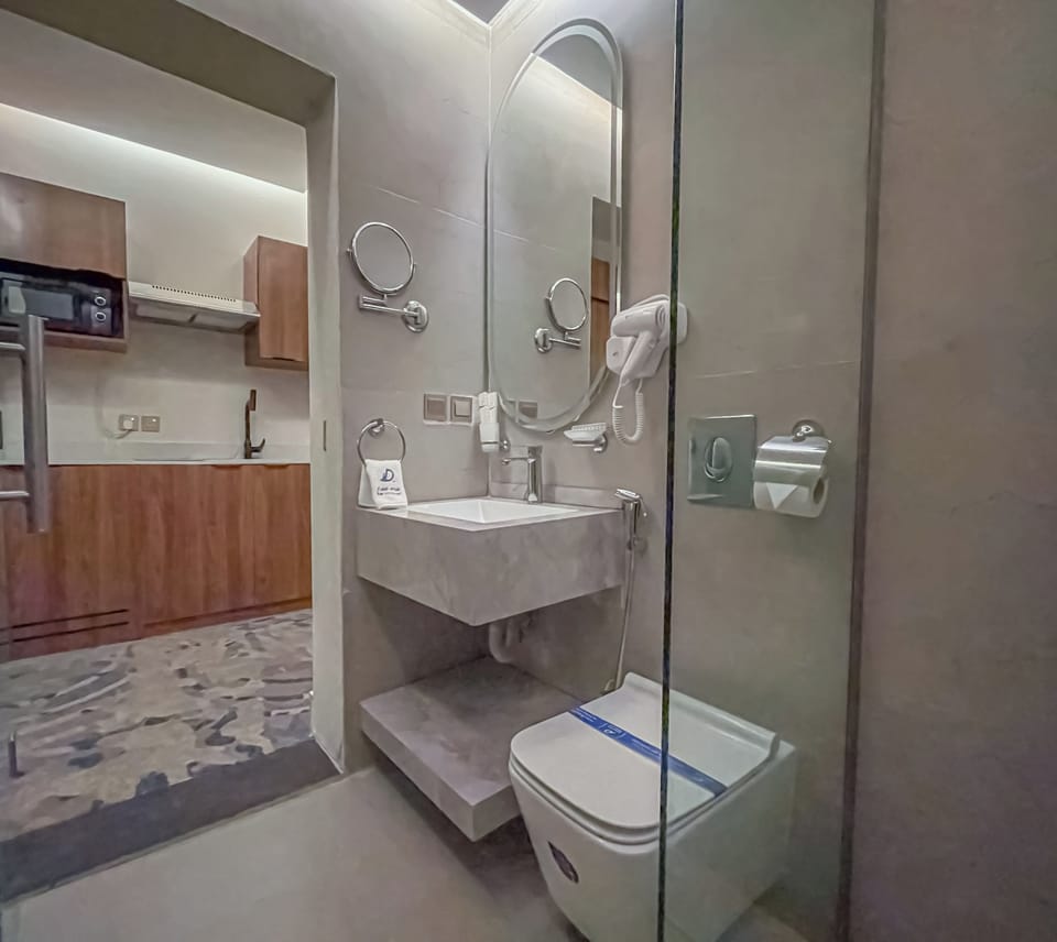 Suite, 1 Bedroom | Bathroom | Shower, hair dryer, bathrobes, slippers
