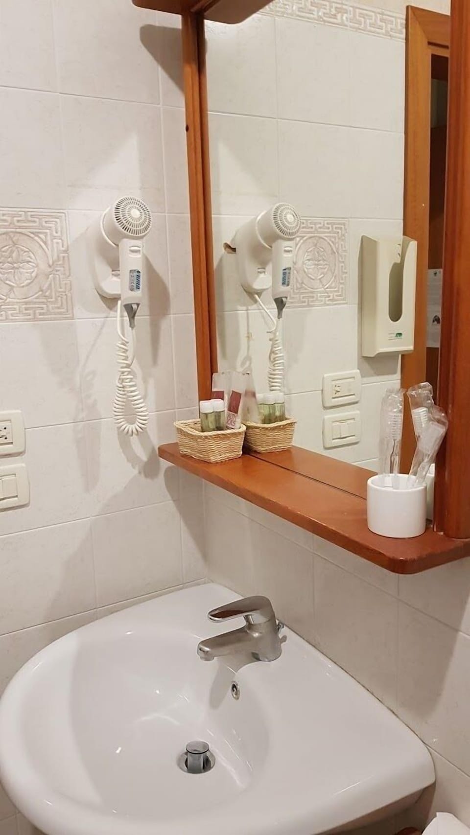 Combined shower/tub, free toiletries, hair dryer, slippers