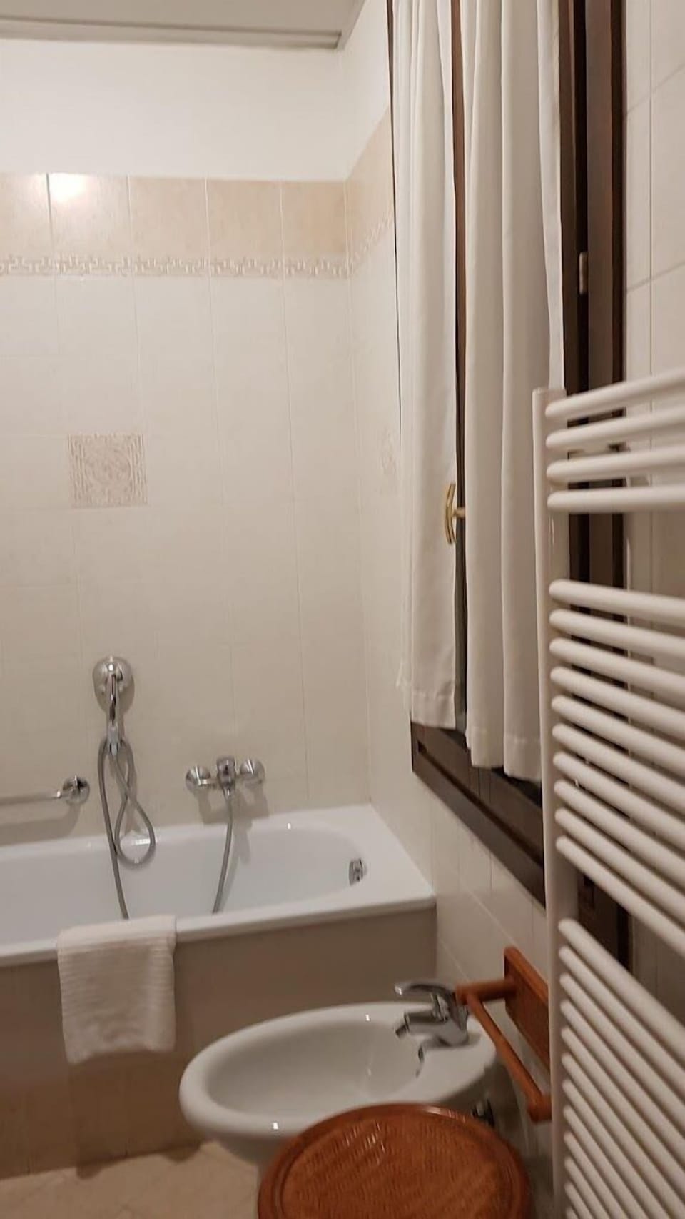 Combined shower/tub, free toiletries, hair dryer, slippers