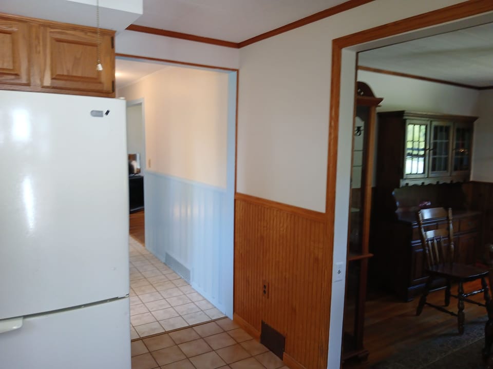 View from kitchen - dining room + hallway to living room and bedrooms