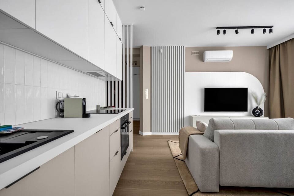 Living Room with Full Sofa Bed and Dining Area - Smart TV for your enterteinment | Book Now with RENTUJEMY.COM