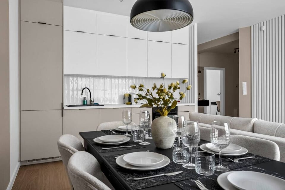 Living Room with Full Sofa Bed and Dining Area - Smart TV for your enterteinment | Book Now with RENTUJEMY.COM