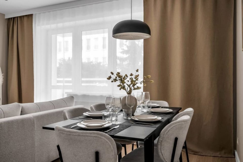 Living Room with Full Sofa Bed and Dining Area - Smart TV for your enterteinment | Book Now with RENTUJEMY.COM