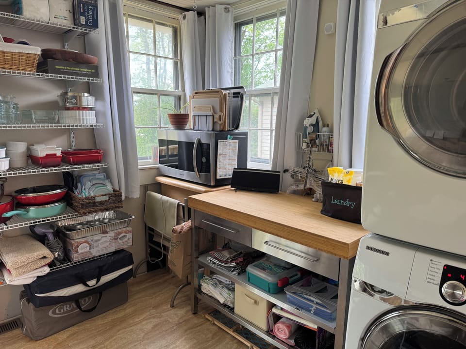 Laundry and pantry with microwave.  This room has blackout curtains.
