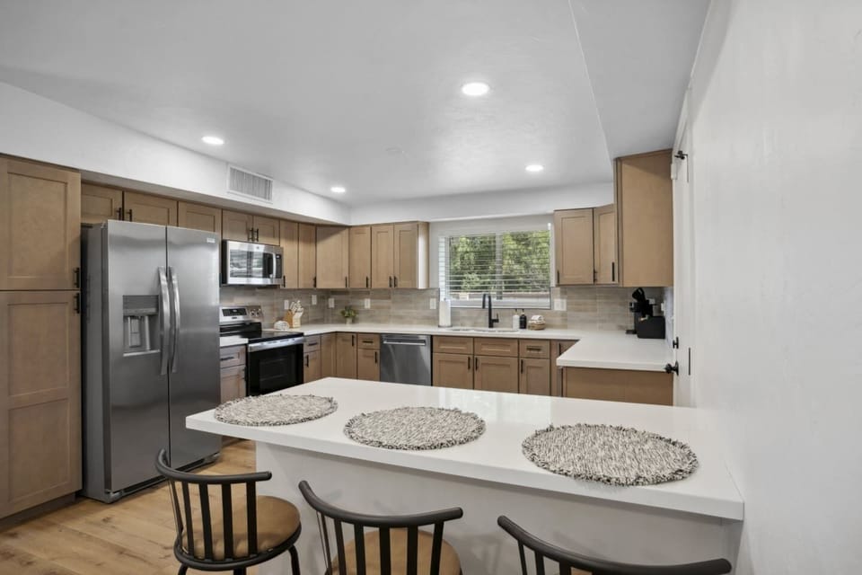 Open kitchen w/ ample counter space & modern appliances, great for cooking at home.