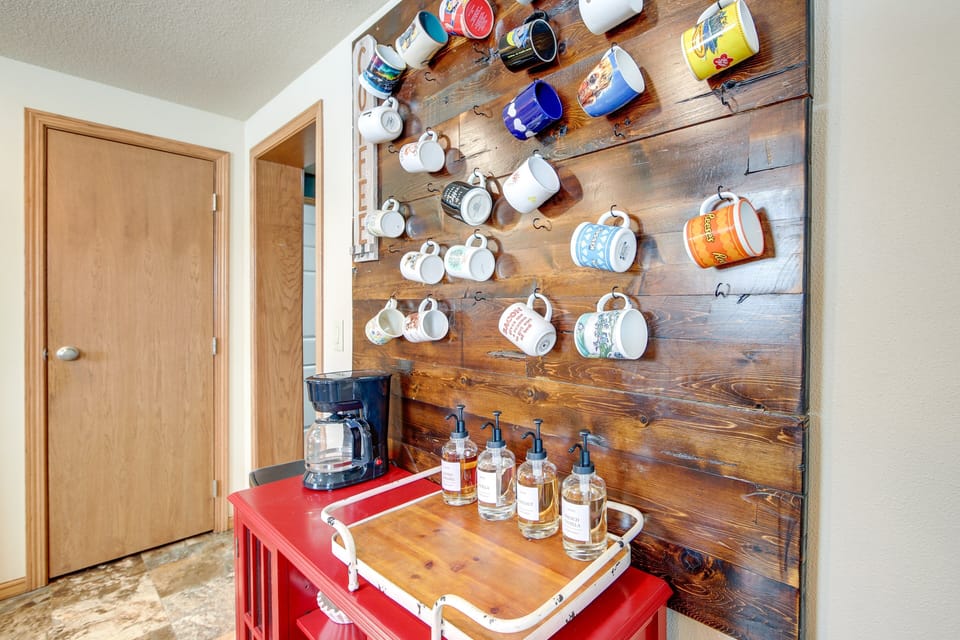 A coffee bar stocked with mugs and flavors to fuel up for your next adventure