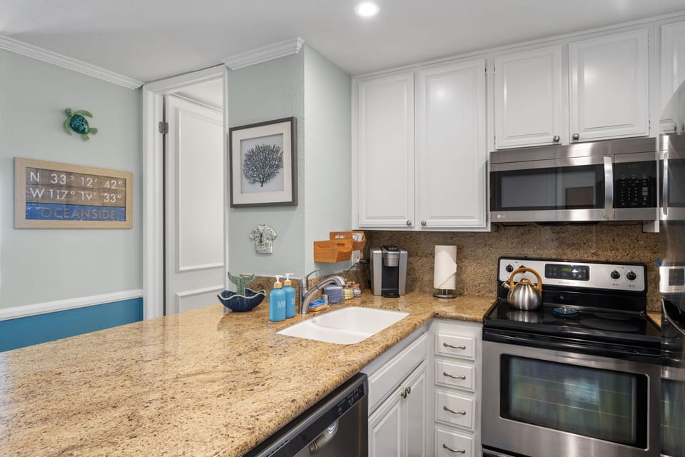 This sleek kitchen comes fully stocked with all the essentials for your vacation.