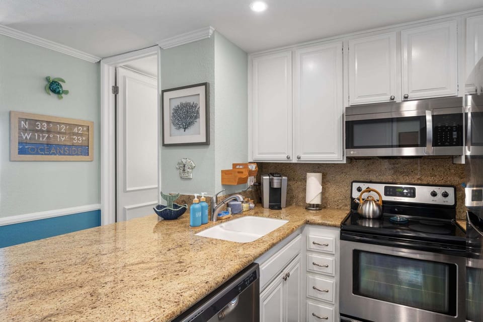 This sleek kitchen comes fully stocked with all the essentials for your vacation.