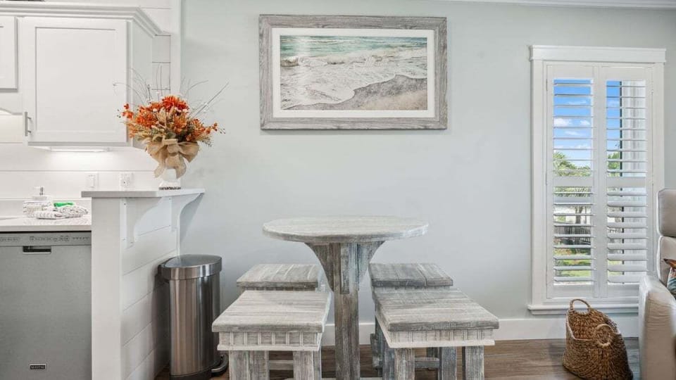 This charming dining nook features a rustic.