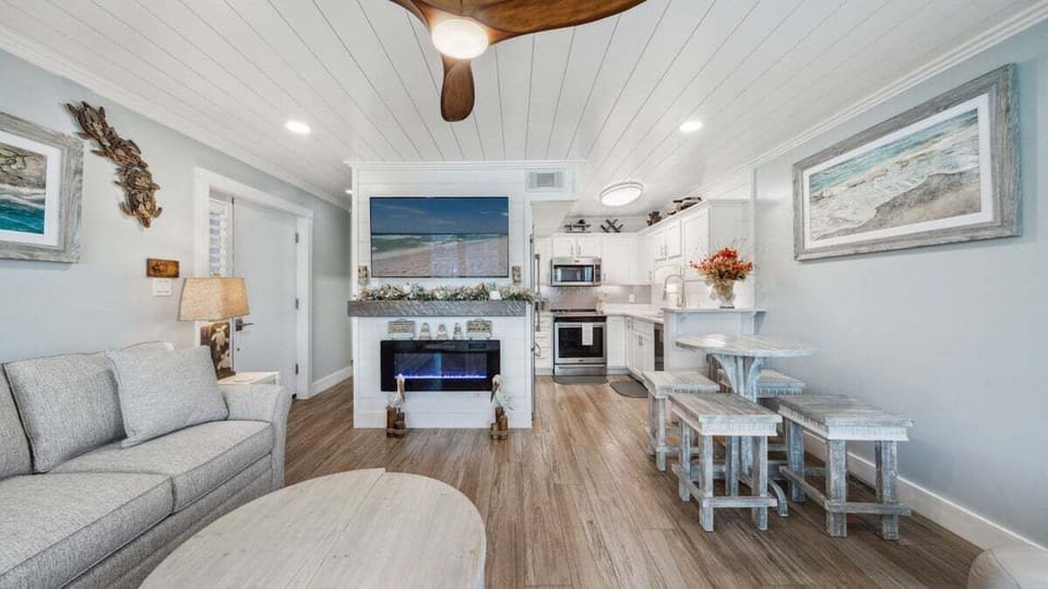 This open-concept living space seamlessly blends coastal comfort with modern design.