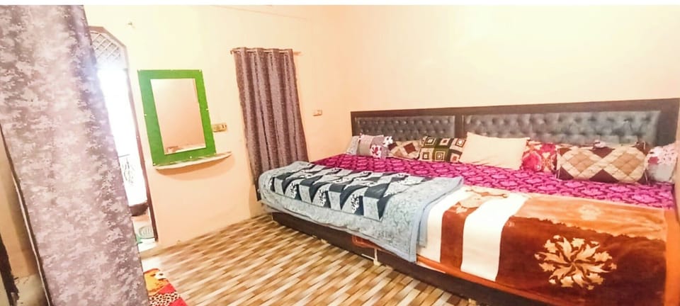 Deluxe Quadruple Room, City View | In-room safe, soundproofing, bed sheets