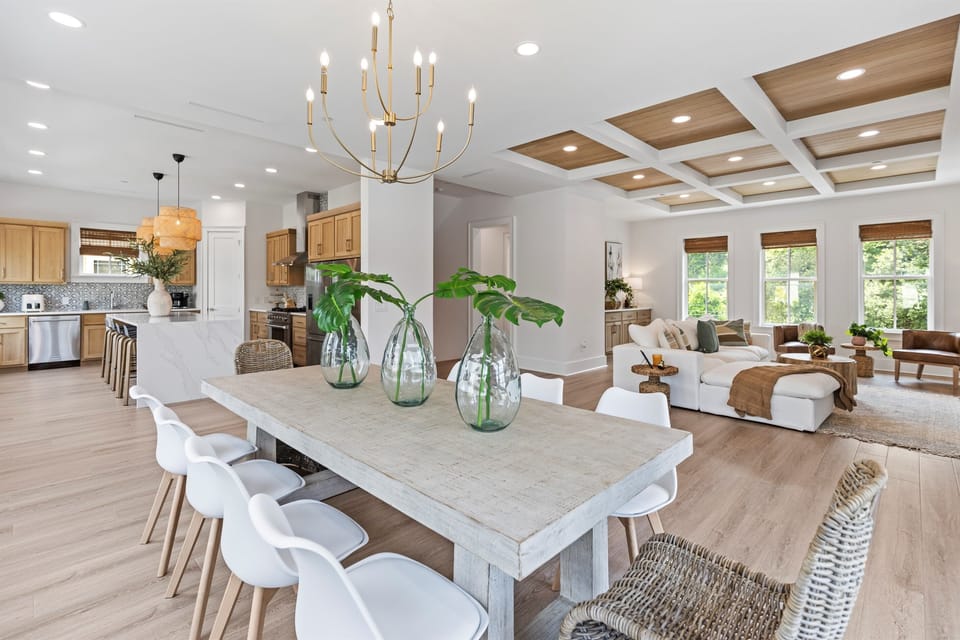 Gather in this stunning open-concept space where your dining table flows seamlessly into the living room, perfect for memorable meals and relaxation.