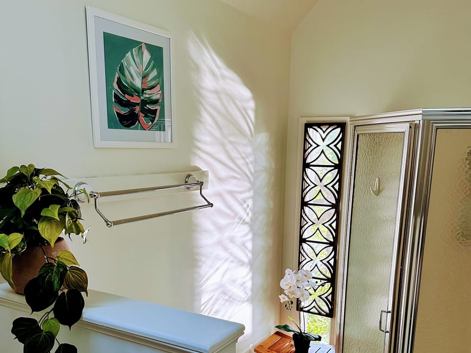 Bright and airy en suite bathroom with skylight