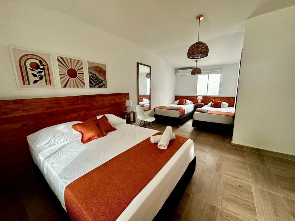 Standard Quadruple Room, Garden View | Select Comfort beds, minibar, in-room safe, desk