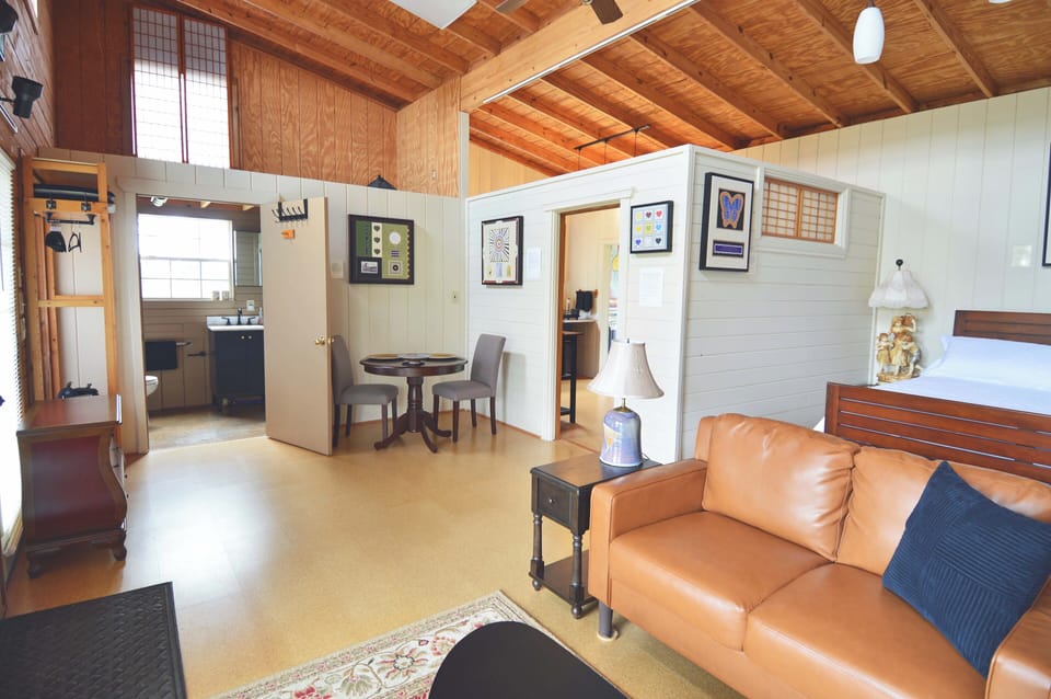 Livingroom looking towards bathroom and separate kitchen
