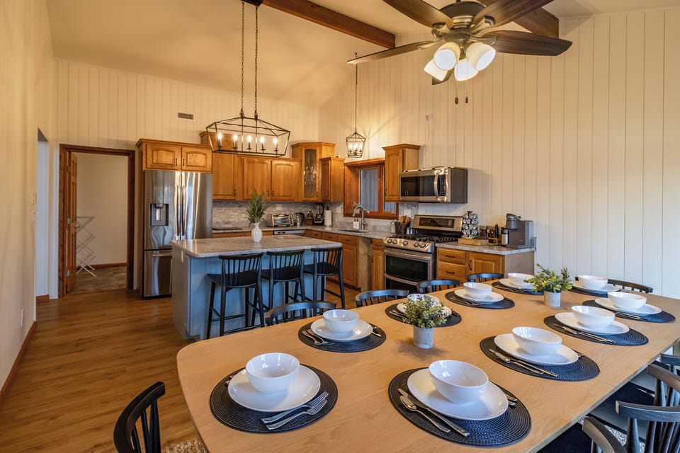 Seating for 10 at the dining table with an additional 3 stools at the counter