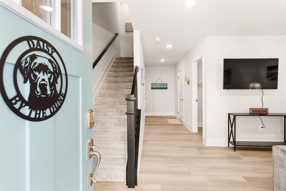 First floor and garage entrance with multiple closets.