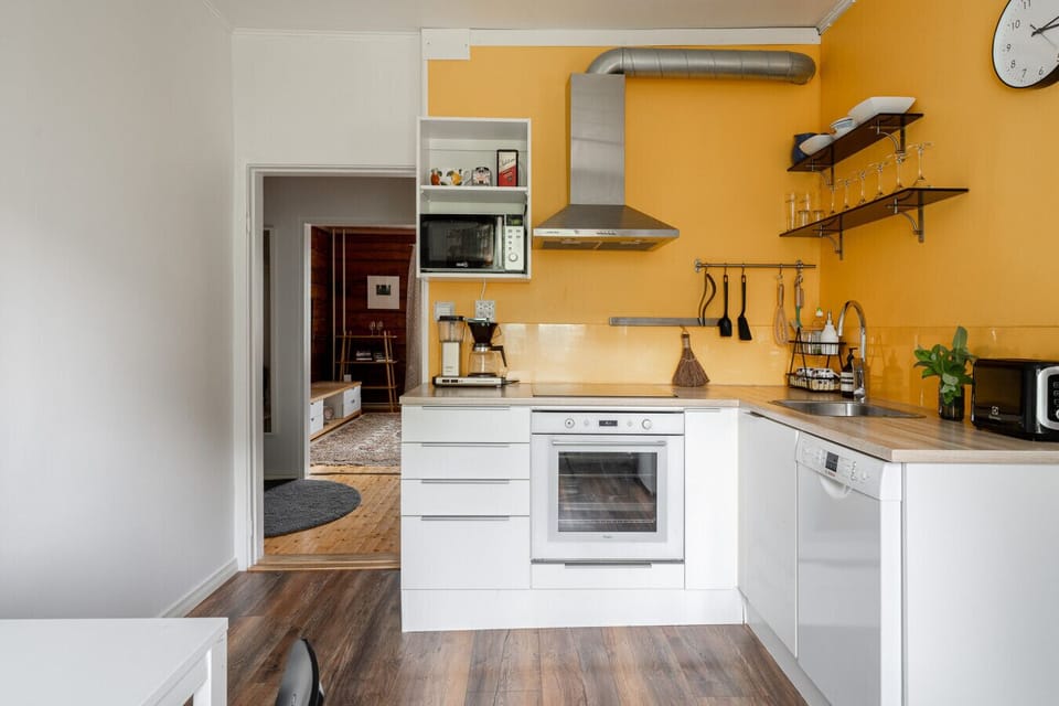 A bright and functional kitchen space, featuring everything you need for a comfortable home-cooked meal.