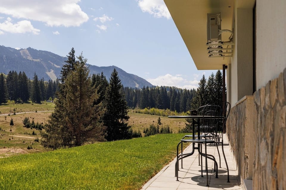 Serene outdoor space with stunning views of the Carpathian Mountains, inviting you to reconnect with nature just steps away from your apartment