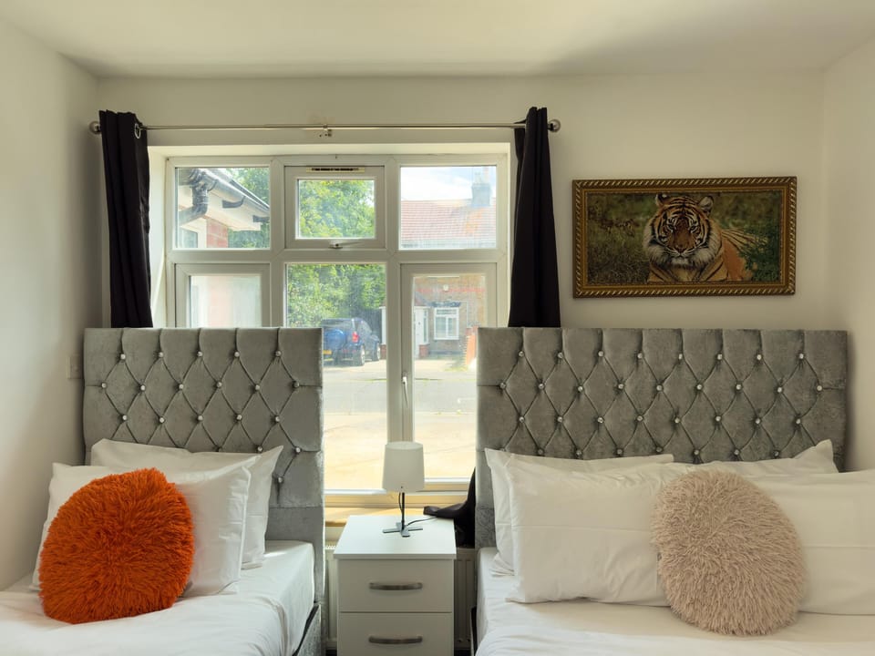 Family Triple Room, Multiple Beds, Shared Bathroom, City View | Memory foam beds, individually decorated, individually furnished, desk