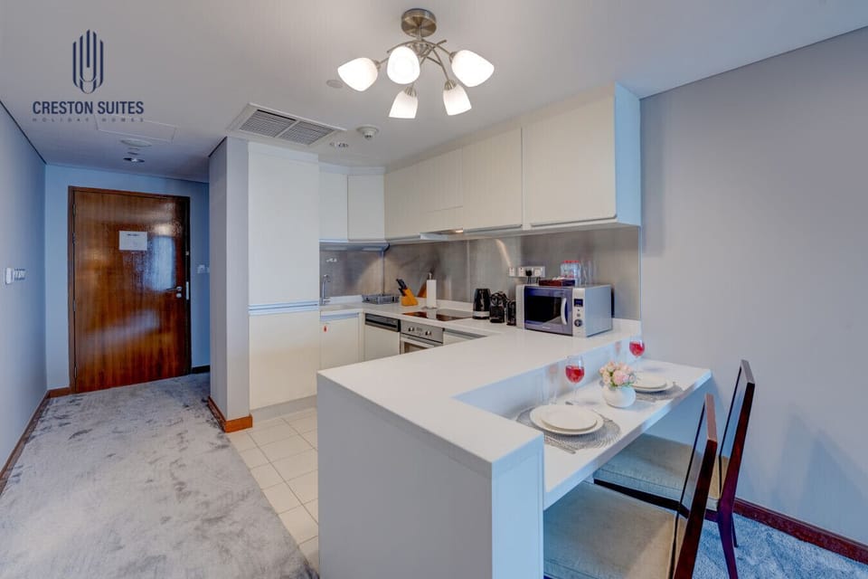 The kitchen and dining area layout and furnishings may vary slightly between rooms, yet each offers a stylish, comfortable, and well-appointed setting for your stay
