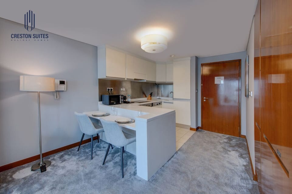 The kitchen and dining area layout and furnishings may vary slightly between rooms, yet each offers a stylish, comfortable, and well-appointed setting for your stay