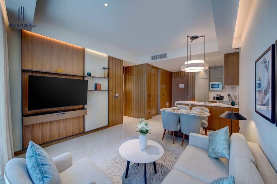 The living room layout and furnishings may differ slightly between apartments, yet each provides a stylish and comfortable setting for your stay.