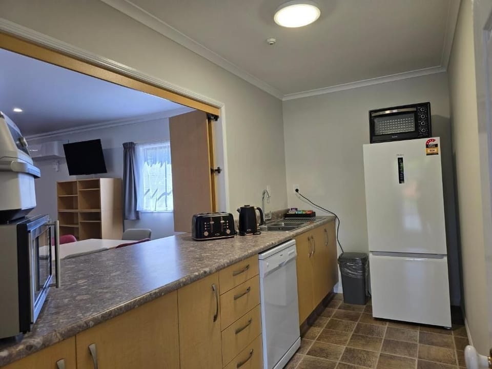 Apartment, Multiple Beds | Private kitchen | Coffee/tea maker, mini-fridge, microwave, dishwasher