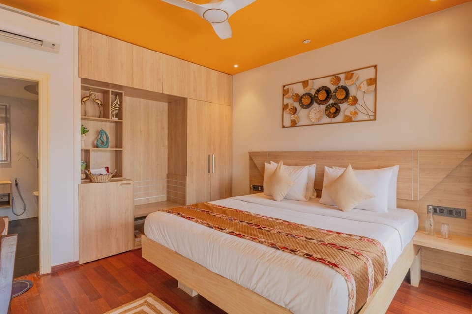 Deluxe Suite, Pool View | Desk, laptop workspace, iron/ironing board, free WiFi