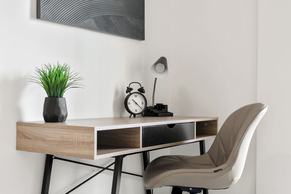 Work-ready corner with ergonomic seating and plenty of daylight.