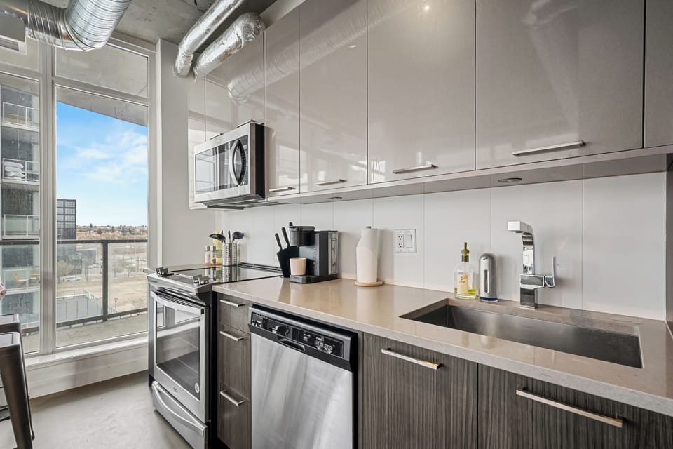 Bright, modern kitchen featuring stainless-steel appliances and everything you need for effortless cooking.