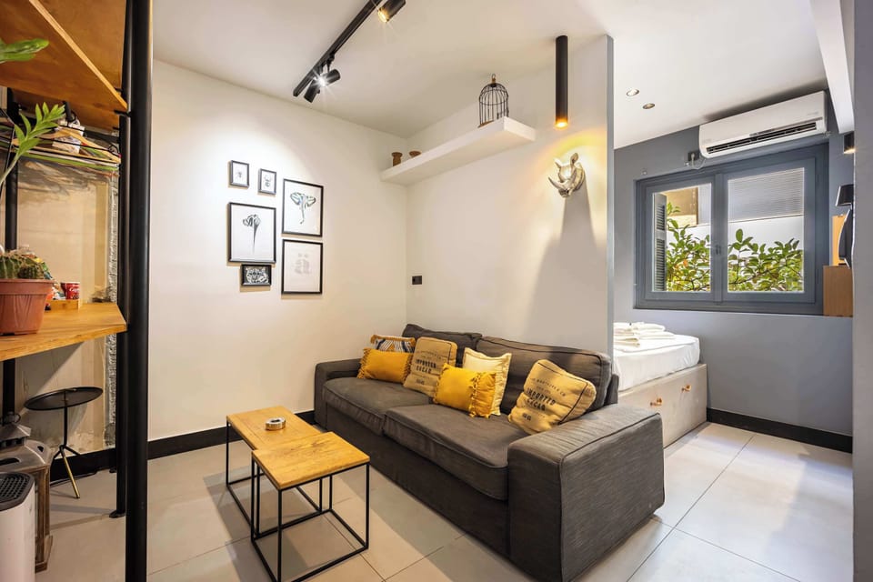 Compact lounge with cozy sofa and air conditioning for comfortable downtime year-round.