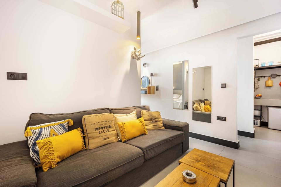 Comfortable sofa area with warm accents, ideal for unwinding in a quiet neighborhood.