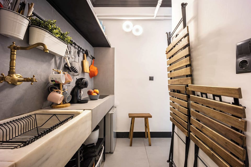 Efficient kitchenette layout maximizing space for easy meal preparation during city stays.