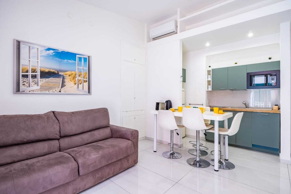 Comfort Apartment, City View | Living area | Flat-screen TV