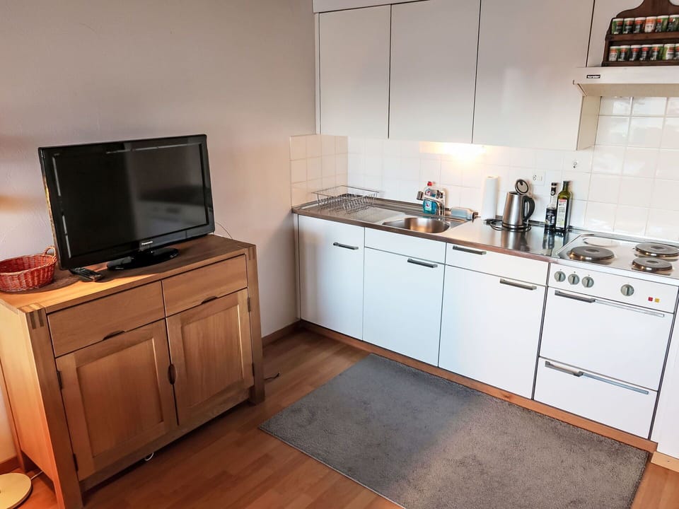 Furniture, Kitchen, Cabinetry, Flooring, Kitchen Appliance, Kitchen Sink, Major Appliance, Wood, Countertop, Interior Design