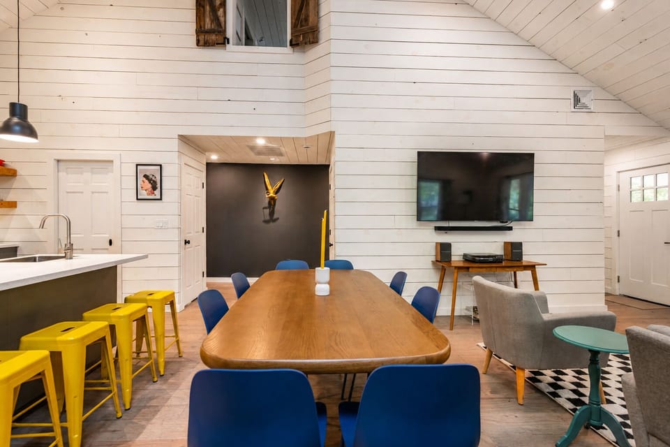 Eat as a group at the table, then move over to the TV and sound system for music or a movie after. The whole space stays connected so no one's left out of the fun.