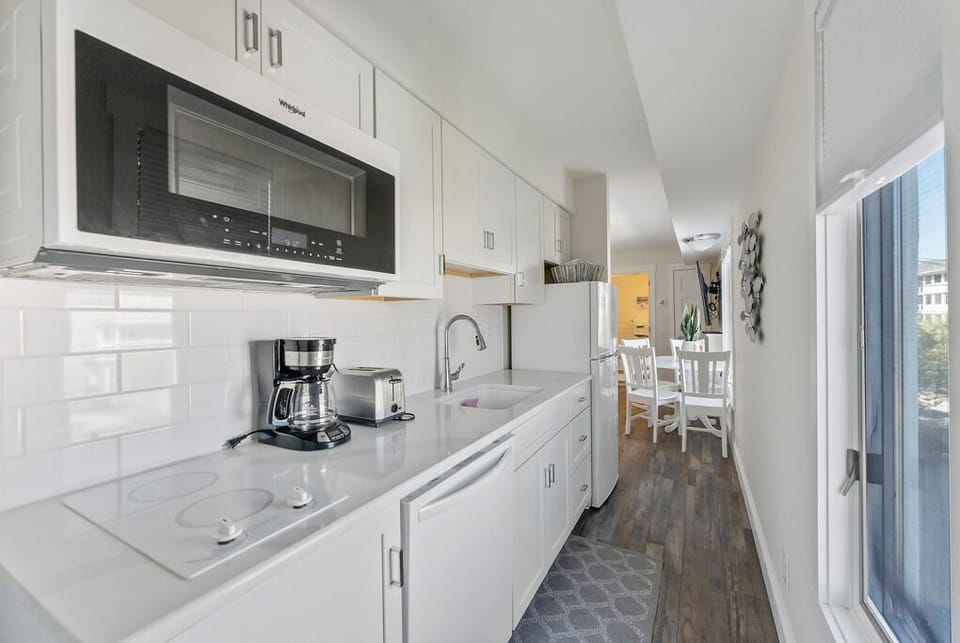 Cozy kitchen area with sleek amenities
