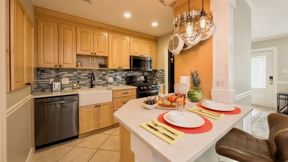 The kitchen is outfitted with modern, upscale appliances...