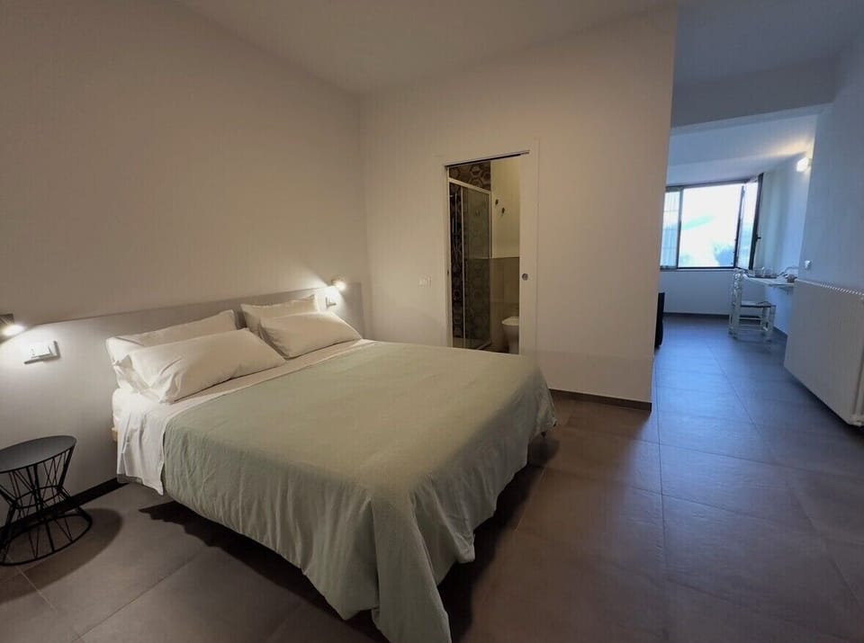 Deluxe Triple Room, Mountain View | In-room safe, blackout drapes, iron/ironing board, free WiFi