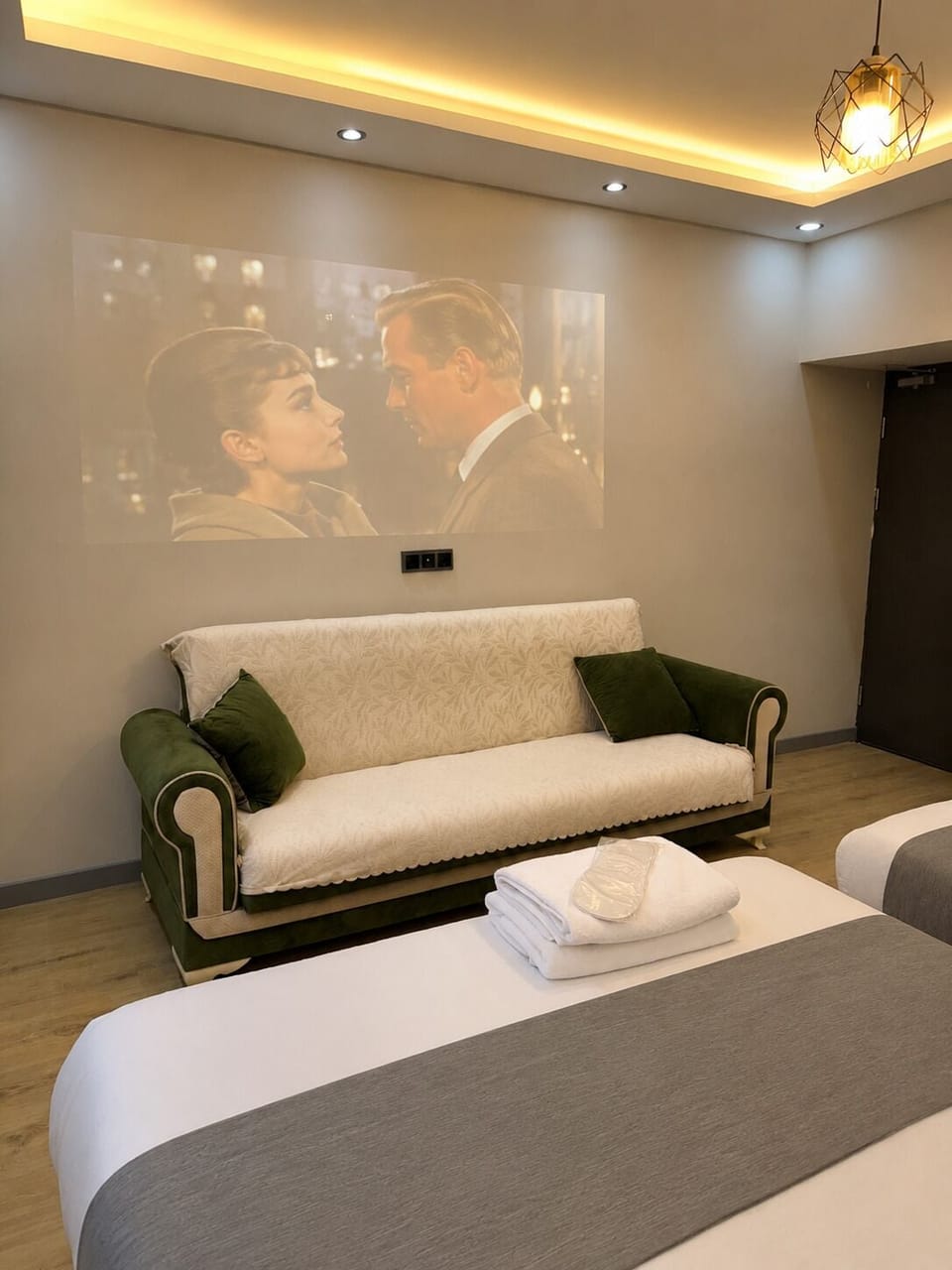 Deluxe Quadruple Room, Garden View | Living area