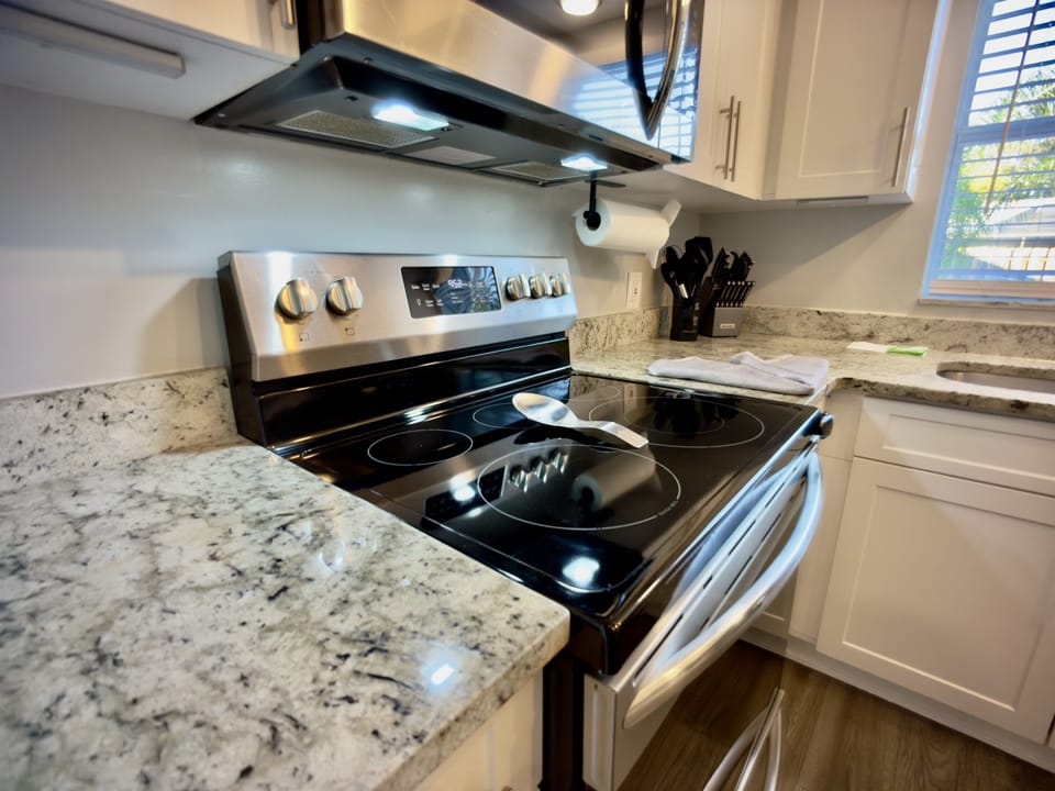 This modern kitchen boasts premium appliances, plenty of counter space, and all the essentials to create delicious home-cooked meals.