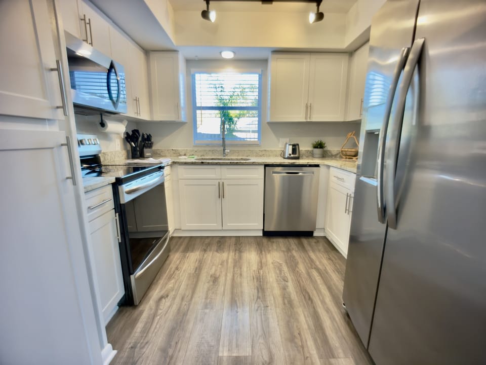 Whip up your favorite meals in a fully equipped chef’s kitchen featuring top-of-the-line appliances, spacious countertops, and all the cookware you need.