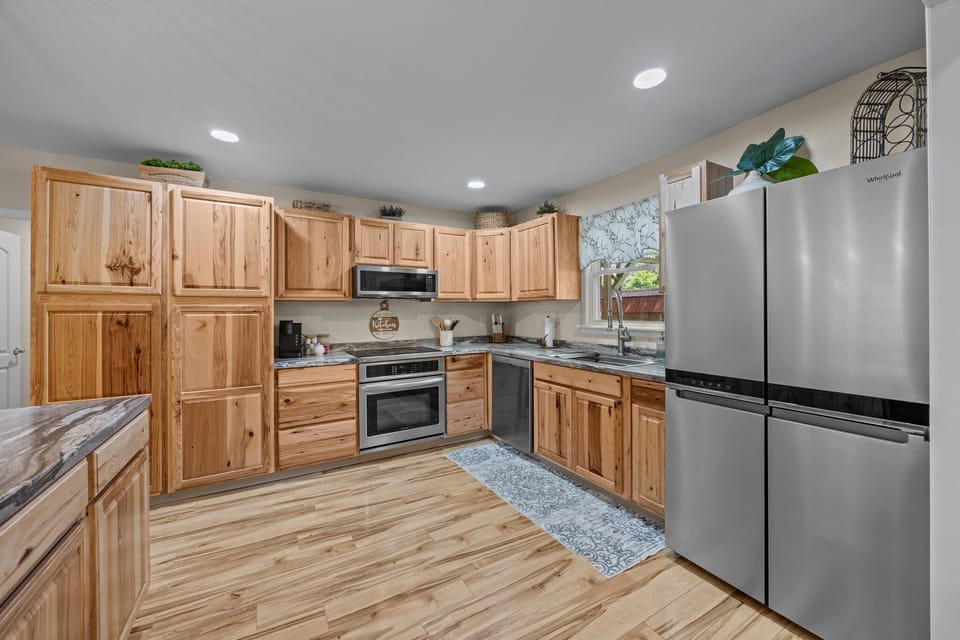 Modern kitchen with stainless appliances & all essentials for your stay.