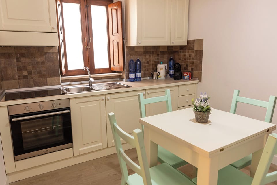 Family Apartment, Balcony | Private kitchen | Highchair