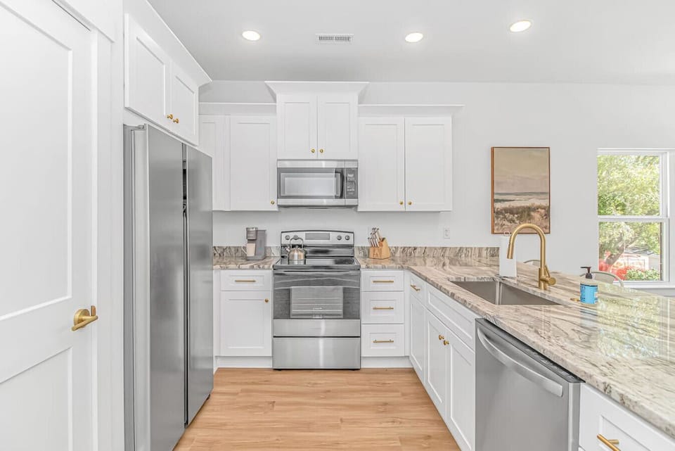 Fully equipped kitchen with stainless steel appliances and spacious layout